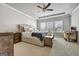 Spacious bedroom with ample natural light, a tray ceiling, and comfortable furnishings, creating a relaxing retreat at 4760 Highside Way, Smyrna, GA 30082