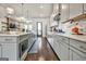 Well-equipped kitchen boasting modern gray cabinetry, stainless steel appliances, quartz countertops, and ample counter space at 4760 Highside Way, Smyrna, GA 30082