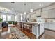 Bright, modern kitchen with an expansive island, pendant lighting, stainless appliances, and seating for four at 4760 Highside Way, Smyrna, GA 30082