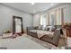Cozy living room with plush seating, mirror, and ample natural light, perfect for unwinding at 4760 Highside Way, Smyrna, GA 30082