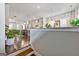 Open-concept living space featuring hardwood floors, modern lighting, and a view into the adjacent gourmet kitchen at 4760 Highside Way, Smyrna, GA 30082