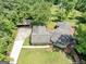 Aerial view of the property showcasing the home's layout, driveway, and surrounding landscape at 4820 Yeager Rd, Douglasville, GA 30135