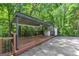 Spacious covered deck perfect for outdoor entertaining and relaxing in a wooded backyard at 4820 Yeager Rd, Douglasville, GA 30135