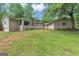 Expansive backyard featuring a well-maintained lawn, mature trees, and an inviting exterior at 4820 Yeager Rd, Douglasville, GA 30135