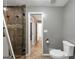 Nicely finished bathroom with grey walls, tile flooring, and white toilet at 4820 Yeager Rd, Douglasville, GA 30135
