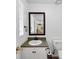 Cozy bathroom featuring a classic vanity with a mirror, and a toilet, perfect for everyday use at 4820 Yeager Rd, Douglasville, GA 30135