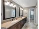Double vanity in the bathroom provides ample counter space, enhancing luxury at 4820 Yeager Rd, Douglasville, GA 30135