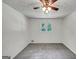 Sunlit bedroom with neutral walls and floors and a ceiling fan at 4820 Yeager Rd, Douglasville, GA 30135