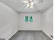 Bedroom with gray carpet, a window, and a ceiling fan at 4820 Yeager Rd, Douglasville, GA 30135