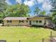 Charming ranch-style home with a well-maintained lawn, mature trees, and inviting curb appeal at 4820 Yeager Rd, Douglasville, GA 30135