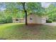 Charming home with a lush green lawn and mature trees providing shade and curb appeal at 4820 Yeager Rd, Douglasville, GA 30135