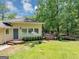 Attractive exterior with a charming front porch, perfect for enjoying the outdoors at 4820 Yeager Rd, Douglasville, GA 30135