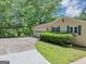 Home featuring a two-car garage, covered parking, and landscaping at 4820 Yeager Rd, Douglasville, GA 30135