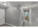 A bright hallway with neutral walls and floors leads to other rooms at 4820 Yeager Rd, Douglasville, GA 30135