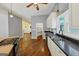 Open kitchen features hardwood floors, stainless appliances, a center island with cooktop, and ample cabinetry at 4820 Yeager Rd, Douglasville, GA 30135
