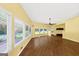 Open-concept living area boasts hardwood floors, large windows with pool views, and recessed lighting at 4820 Yeager Rd, Douglasville, GA 30135