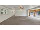 Bright living room featuring carpet flooring and windows with natural light, ideal for comfort and appeal at 4820 Yeager Rd, Douglasville, GA 30135