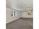 Bright living room with carpet flooring, ceiling fan, and natural light enhancing comfort and appeal at 4820 Yeager Rd, Douglasville, GA 30135