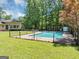 Inviting pool with a large grassy area, perfect for outdoor recreation and relaxation at 4820 Yeager Rd, Douglasville, GA 30135
