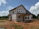 Exterior view displaying the back of the house and covered porch during construction at 1936 King Mill Rd, Mcdonough, GA 30252