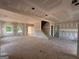 Unfinished living room showcases a spacious layout, natural light, and staircase at 1936 King Mill Rd, Mcdonough, GA 30252