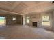 Spacious unfinished living room with fireplace and a sliding glass door to the exterior at 1936 King Mill Rd, Mcdonough, GA 30252