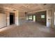 Unfinished living room with ample natural light and access to an adjacent room at 1936 King Mill Rd, Mcdonough, GA 30252