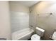 Bright bathroom with tiled shower-tub combo and modern fixtures at 3879 Mcgill Ln, Decatur, GA 30034