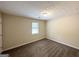 Neutral bedroom featuring carpet floors and a window for natural light at 3879 Mcgill Ln, Decatur, GA 30034