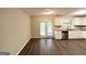 Bright eat-in kitchen with stainless steel appliances, modern lighting, and a view to the back yard at 3879 Mcgill Ln, Decatur, GA 30034