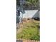 Backyard with a garden plot and grass in need of weeding at 6880 Mountain Cir, Riverdale, GA 30274