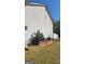 Side view of house with large cactus and garden at 6880 Mountain Cir, Riverdale, GA 30274