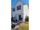 Well-maintained townhouse featuring red shutters and a tidy front yard space at 6880 Mountain Cir, Riverdale, GA 30274