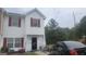 Charming townhouse with a cozy front porch and well-maintained exterior at 6880 Mountain Cir, Riverdale, GA 30274