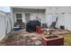 Rear patio featuring a fenced area, furniture, grill, exterior door, and access to an outdoor space at 6880 Mountain Cir, Riverdale, GA 30274