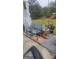 Inviting front porch with charming outdoor seating and decorative potted plants at 6880 Mountain Cir, Riverdale, GA 30274
