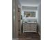 Bathroom vanity features a mirror with lights and drawer storage at 175 Forest Lake Dr, Fayetteville, GA 30215