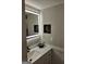 Modern bathroom with white vanity, quartz countertop, lighted mirror, and black hardware at 175 Forest Lake Dr, Fayetteville, GA 30215
