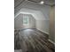 Bedroom with hardwood floors, light-gray walls, a window with a window seat, and a ceiling light at 175 Forest Lake Dr, Fayetteville, GA 30215
