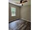 Bedroom with a large window and a ceiling fan at 175 Forest Lake Dr, Fayetteville, GA 30215