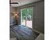 Bedroom with sliding glass door to a deck and views of a wooded backyard at 175 Forest Lake Dr, Fayetteville, GA 30215
