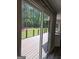 Deck with backyard view through sliding glass door to house at 175 Forest Lake Dr, Fayetteville, GA 30215