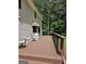 Spacious wooden deck with stylish railings and comfortable outdoor seating, great for entertaining at 175 Forest Lake Dr, Fayetteville, GA 30215