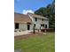 Two-story home featuring a spacious deck, well-maintained lawn, and inviting outdoor seating area at 175 Forest Lake Dr, Fayetteville, GA 30215