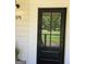 Charming home featuring a black front door and manicured lawn at 175 Forest Lake Dr, Fayetteville, GA 30215