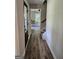 Inviting hallway with hardwood floors, staircase, and black front door at 175 Forest Lake Dr, Fayetteville, GA 30215