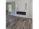 Living room with shiplap fireplace and wood flooring at 175 Forest Lake Dr, Fayetteville, GA 30215