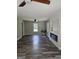 Living room with wood flooring, electric fireplace, and large windows at 175 Forest Lake Dr, Fayetteville, GA 30215
