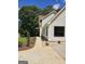 Well-maintained home featuring a landscaped walkway, accented by verdant shrubs and lush greenery at 175 Forest Lake Dr, Fayetteville, GA 30215