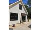 Side exterior showing landscaping and an entrance with two modern lights at 175 Forest Lake Dr, Fayetteville, GA 30215